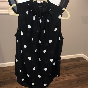 Black sleeveless blouse w/white Polka Dots